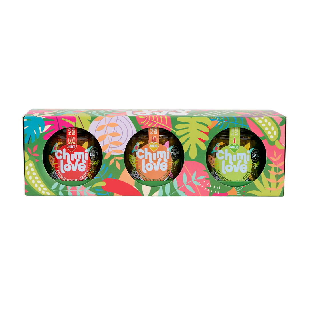 Three containers of Chimi Love on a colorful box with a white background