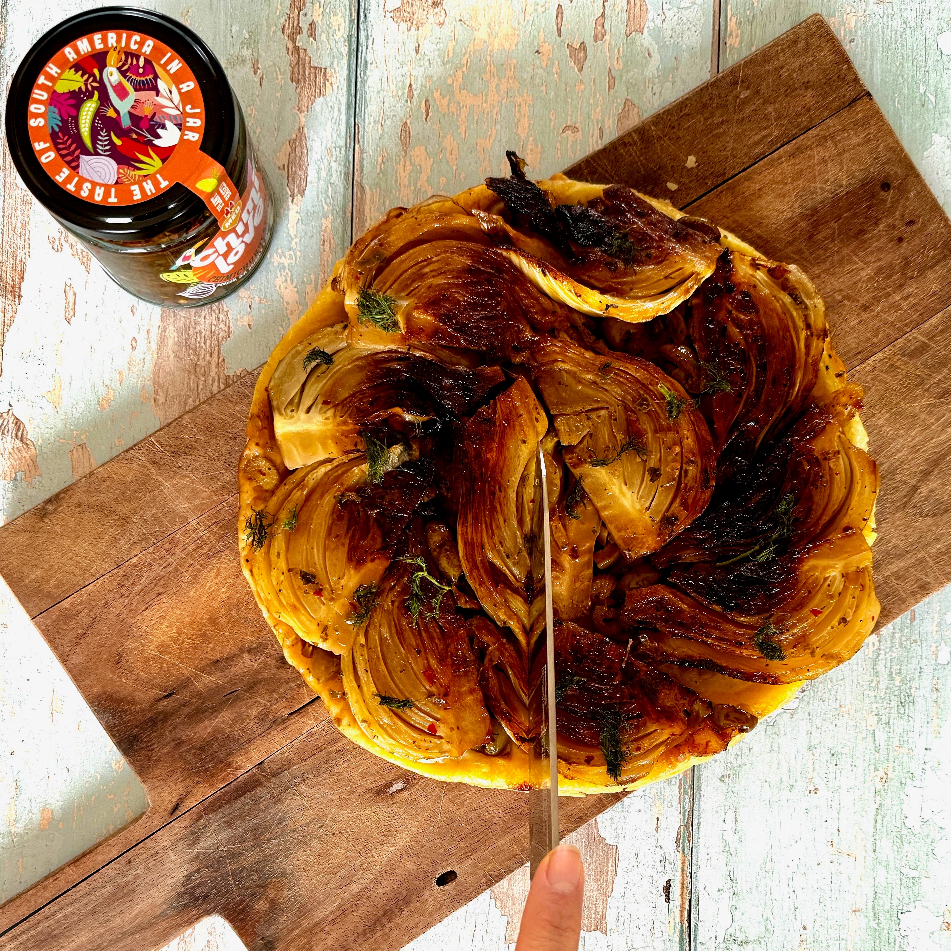 Caramelised fennel tart with grapes, olives and chimichurri
